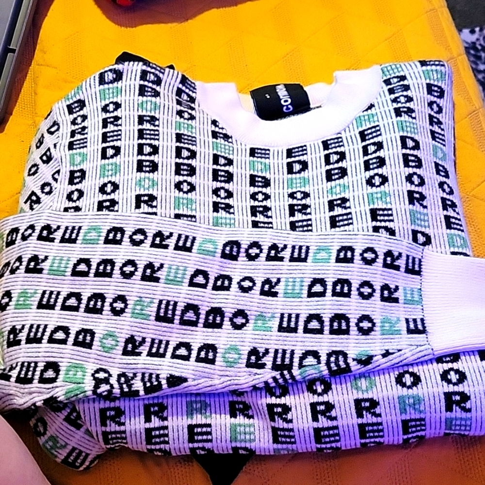 New Collusion sweater, "bored" print. Size Large. Green and cream color pattern.